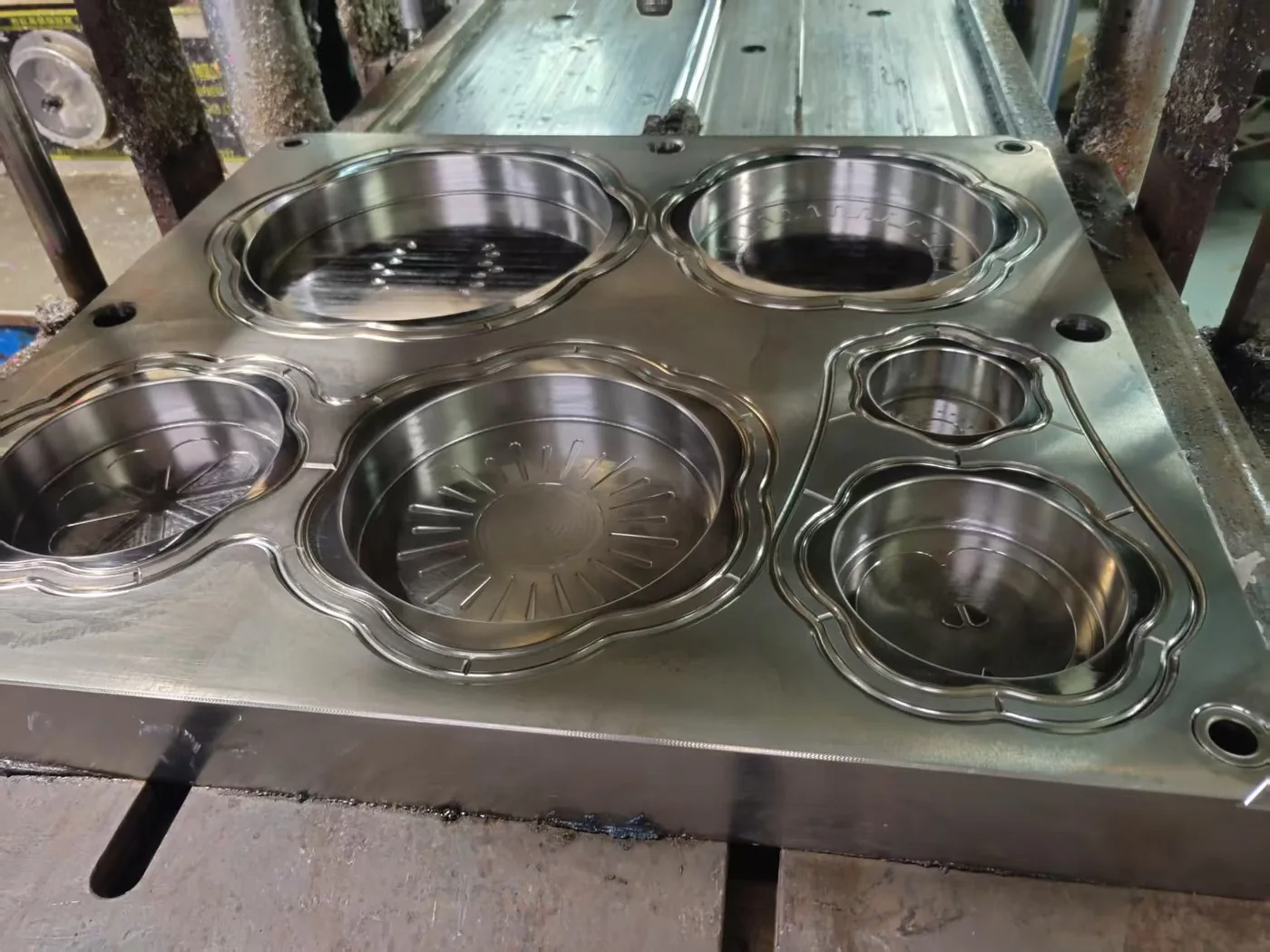 Machined steel mold with several circular cavities